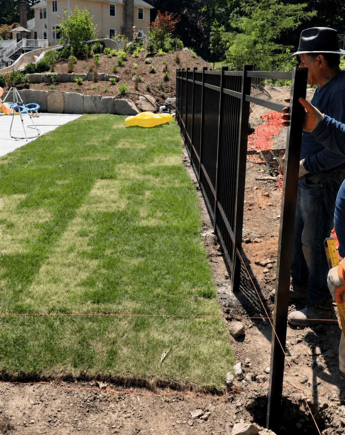 Ace Fence crew installing black aluminum fencing